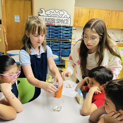 Students collaborating in the Maker Space on a STEM activity